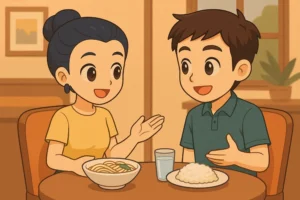 A smiling woman and man sit at a table with bowls of food and a glass, talking in a cozy dining room.